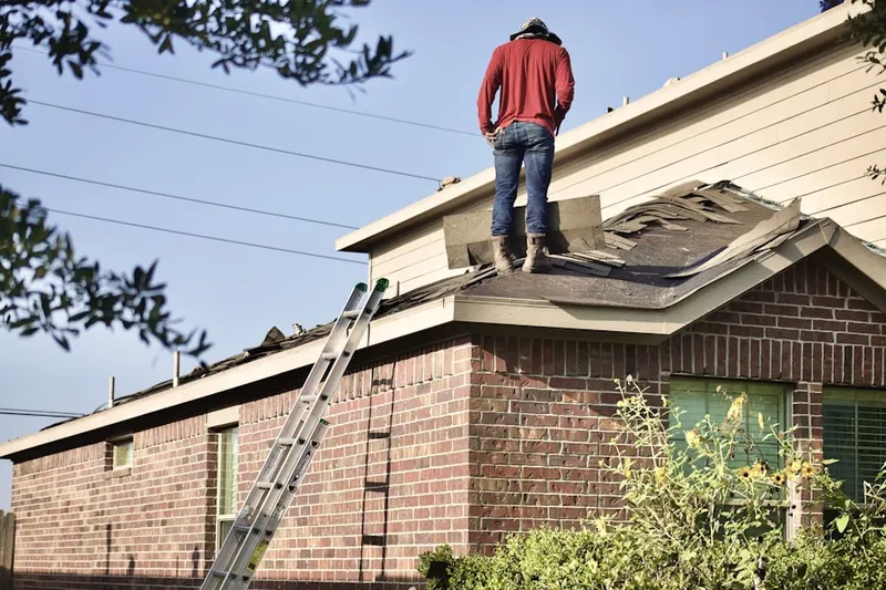 Professional roofer working on a residential roof in New Vernon